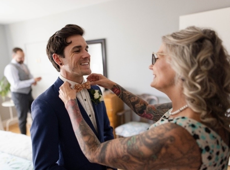 person in suit with bowtie